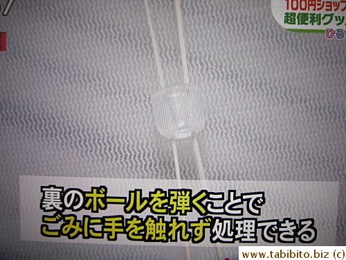 It has this elastic string and a ball thing on the reverse side